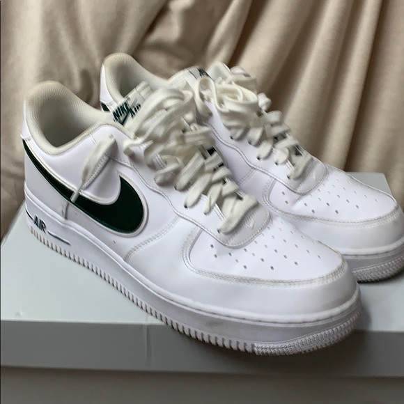 white nikes with green swoosh